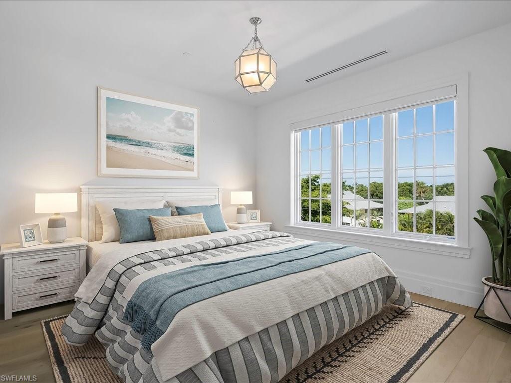745 12th Avenue South, Unit 102 Naples, FL 34102 - Photo 33 of 50 a bedroom with a bed and a window
