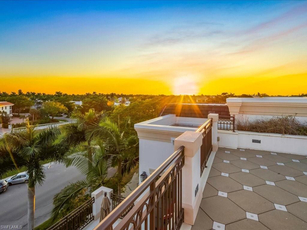 745 12th Avenue South, Unit 102 Naples, FL 34102 - Photo 4 of 50 a terrace view with two chairs