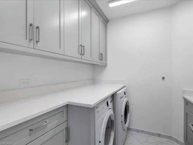 a utility room with cabinets