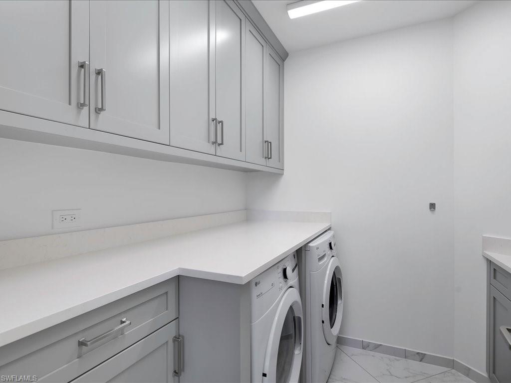 745 12th Avenue South, Unit 102 Naples, FL 34102 - Photo 42 of 50 a utility room with cabinets