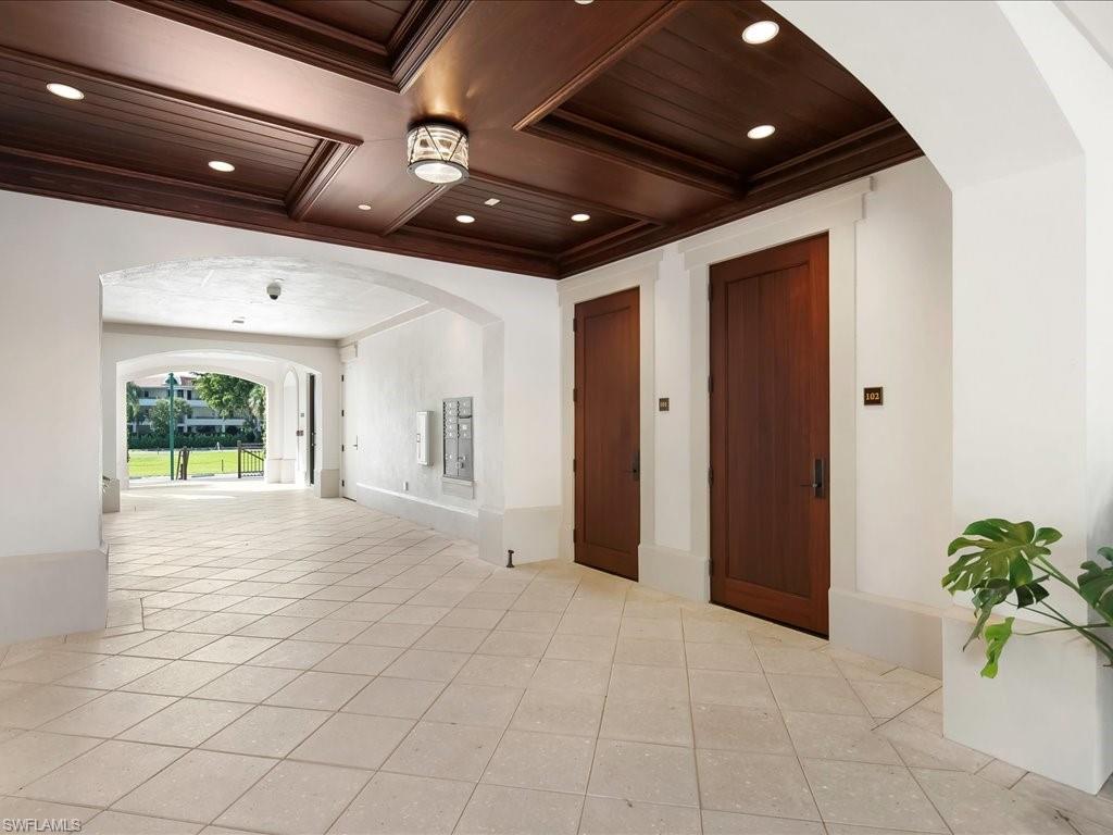 745 12th Avenue South, Unit 102 Naples, FL 34102 - Photo 45 of 50 a view of an empty room with a window and potted plant