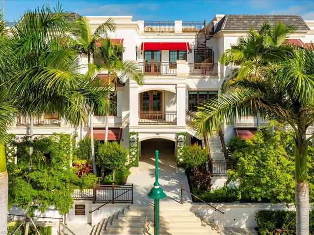 a view of a house with a lounge chairs