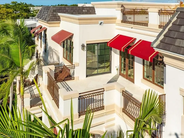 an aerial view of residential house with outdoor space and trees