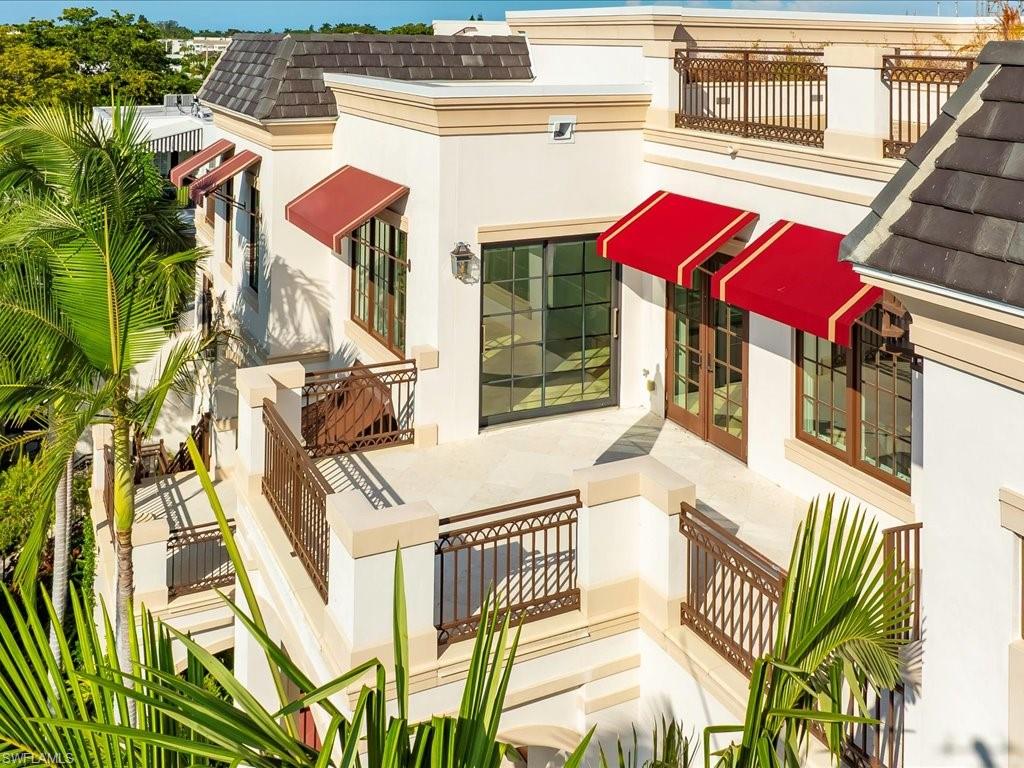 745 12th Avenue South, Unit 102 Naples, FL 34102 - Photo 47 of 50 a view of a house with a lounge chairs
