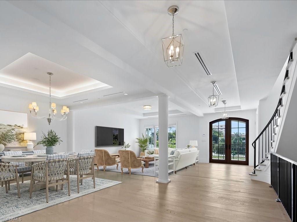 745 12th Avenue South, Unit 102 Naples, FL 34102 - Photo 8 of 50 a view of a livingroom with furniture window and wooden floor