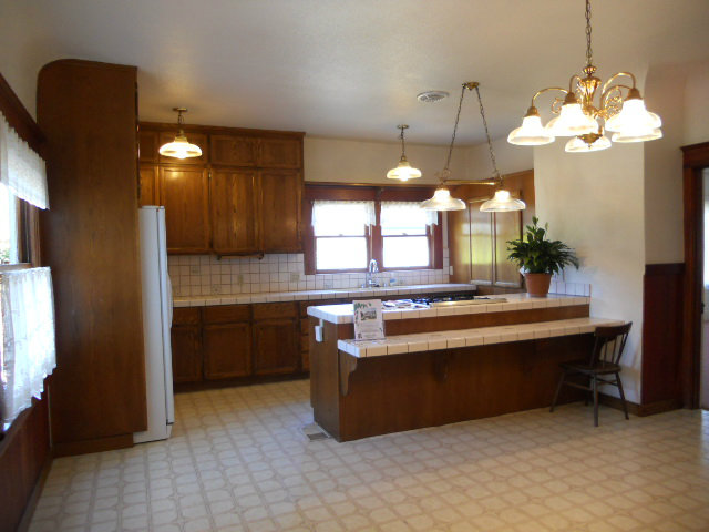 864 Green Valley Road Watsonville, CA 95076 - Photo 8 of 25 a large kitchen with kitchen island a chandelier stainless steel appliances and cabinets