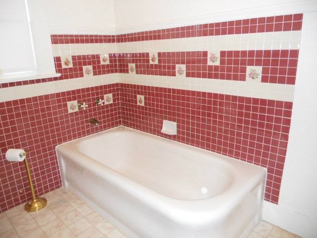 864 Green Valley Road Watsonville, CA 95076 - Photo 9 of 25 a bathroom with a bathtub and a shower