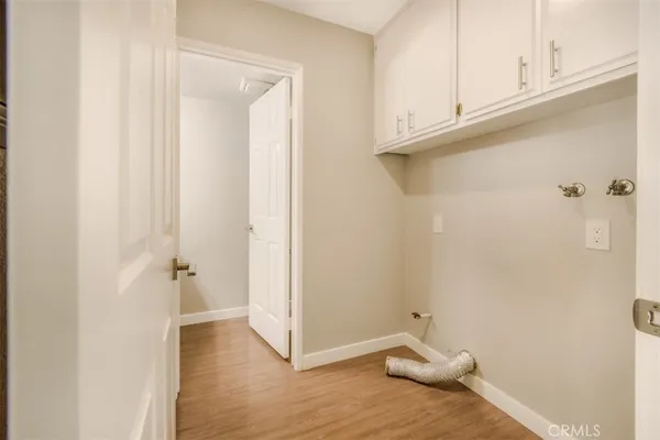 a view of small space with wooden floor