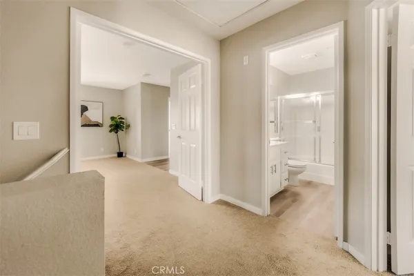 a view of a room that has a bed in it