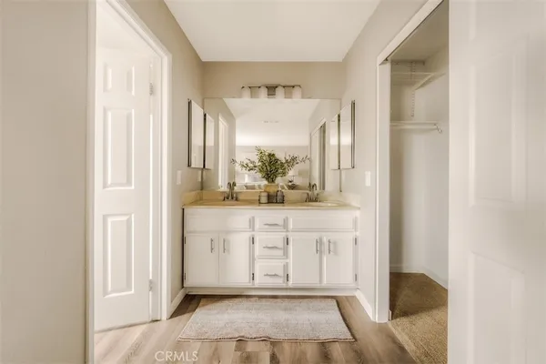 a bathroom with a vanity and a mirror