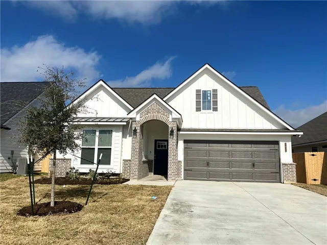 a front view of a house with yard