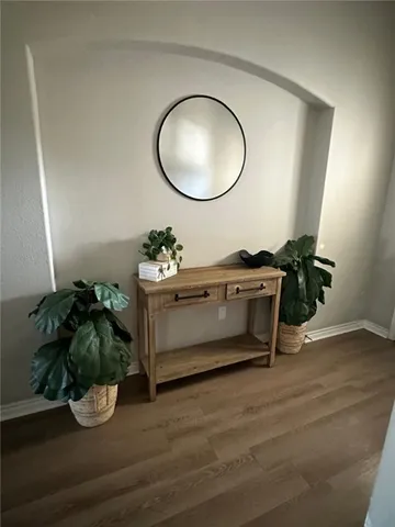 a bedroom with bed and a window