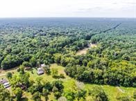 24831 River Terrace Road Huffman, TX 77336 - Photo 6 of 9 a view of a green field with lots of bushes