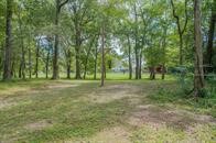 24831 River Terrace Road Huffman, TX 77336 - Photo 7 of 9 a view of outdoor space with trees all around