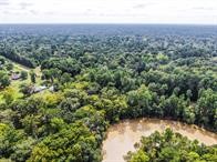 24831 River Terrace Road Huffman, TX 77336 - Photo 8 of 9 an aerial view of residential house with outdoor space and trees around