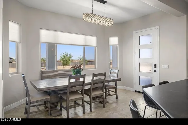 a view of a hallway with wooden floor and closet area