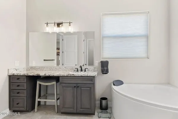 a bathroom with a bathtub and a sink