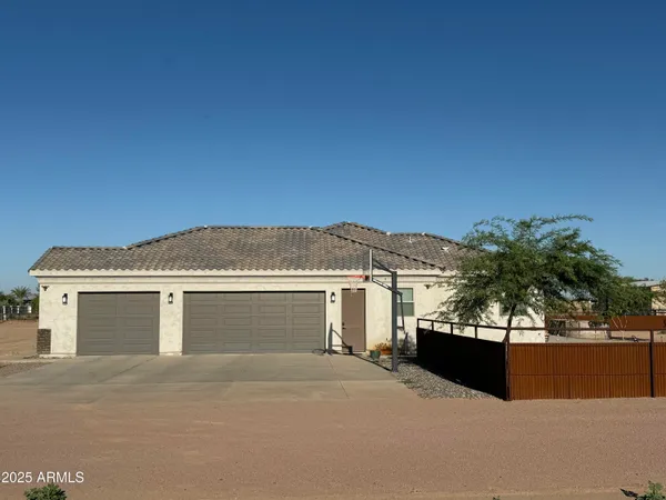 a front view of a house with a garage