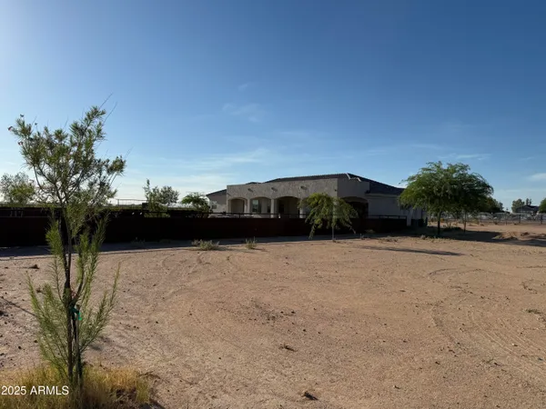 a view of water with a yard