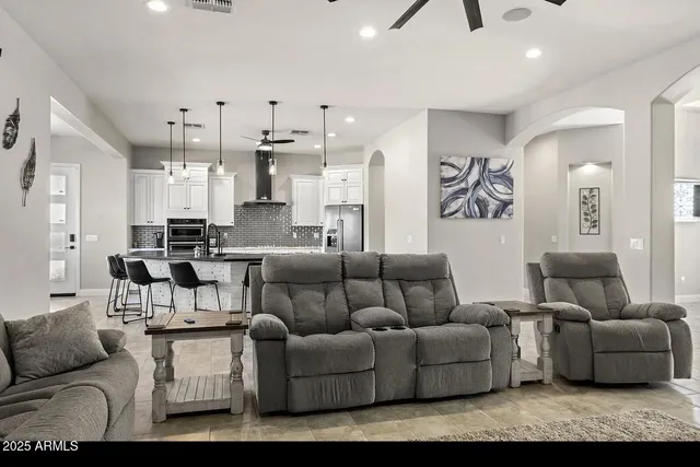 a view interior of a house and livingroom with furniture wooden floor and a rug
