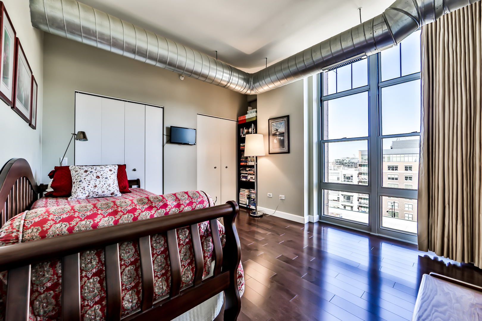 1200 West Monroe Street, Unit 801 Chicago, IL 60607 - Photo 18 of 26 a bedroom with furniture and a window