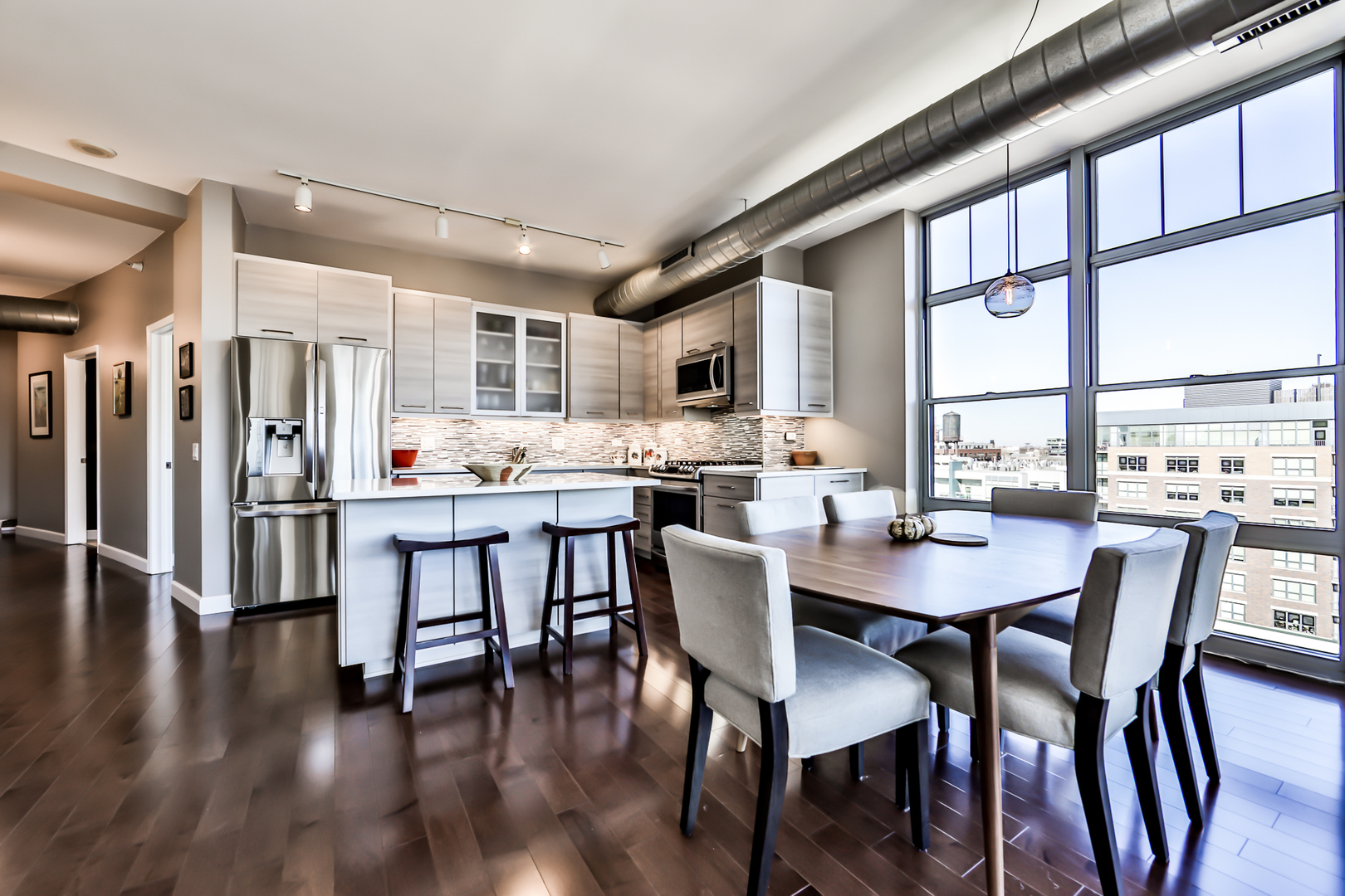 1200 West Monroe Street, Unit 801 Chicago, IL 60607 - Photo 9 of 26 a view of a dining room with furniture window and wooden floor