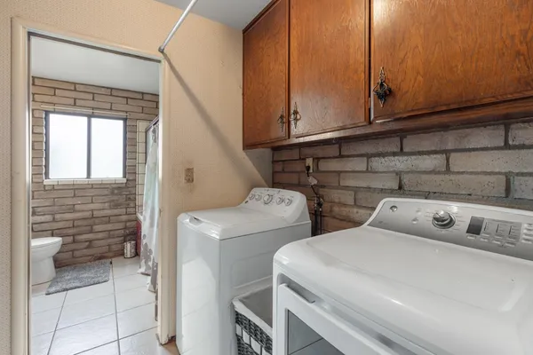 a utility room with dryer and washer