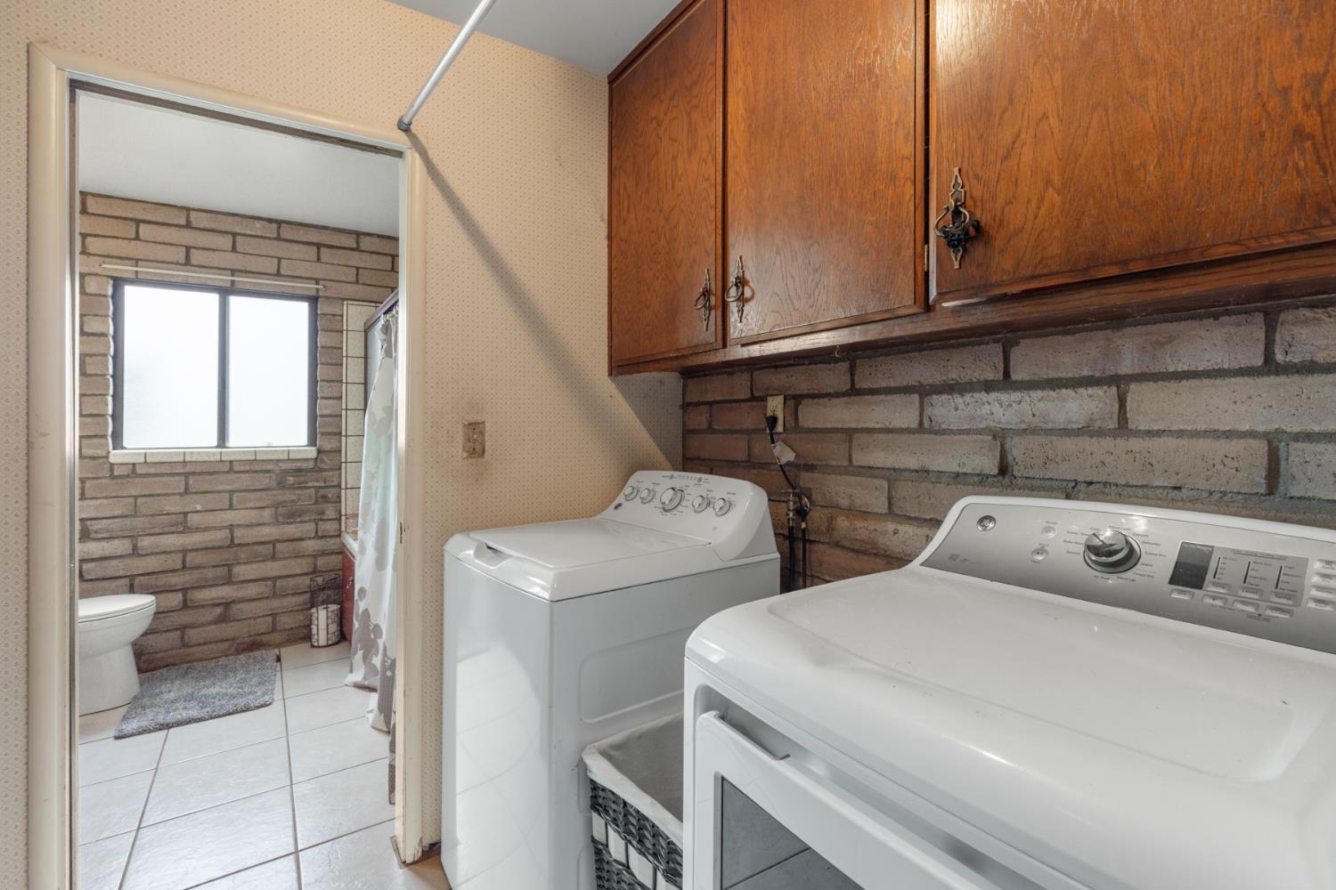 3781 Larkin Road Biggs, CA 95917 - Photo 15 of 34 a utility room with dryer and washer