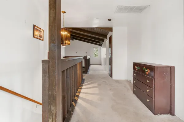 a view of hallway with stairs