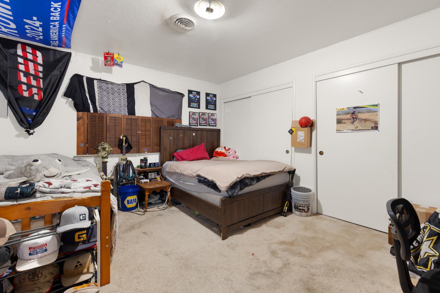 3781 Larkin Road Biggs, CA 95917 - Photo 22 of 34 a bedroom with a bed a books and dresser