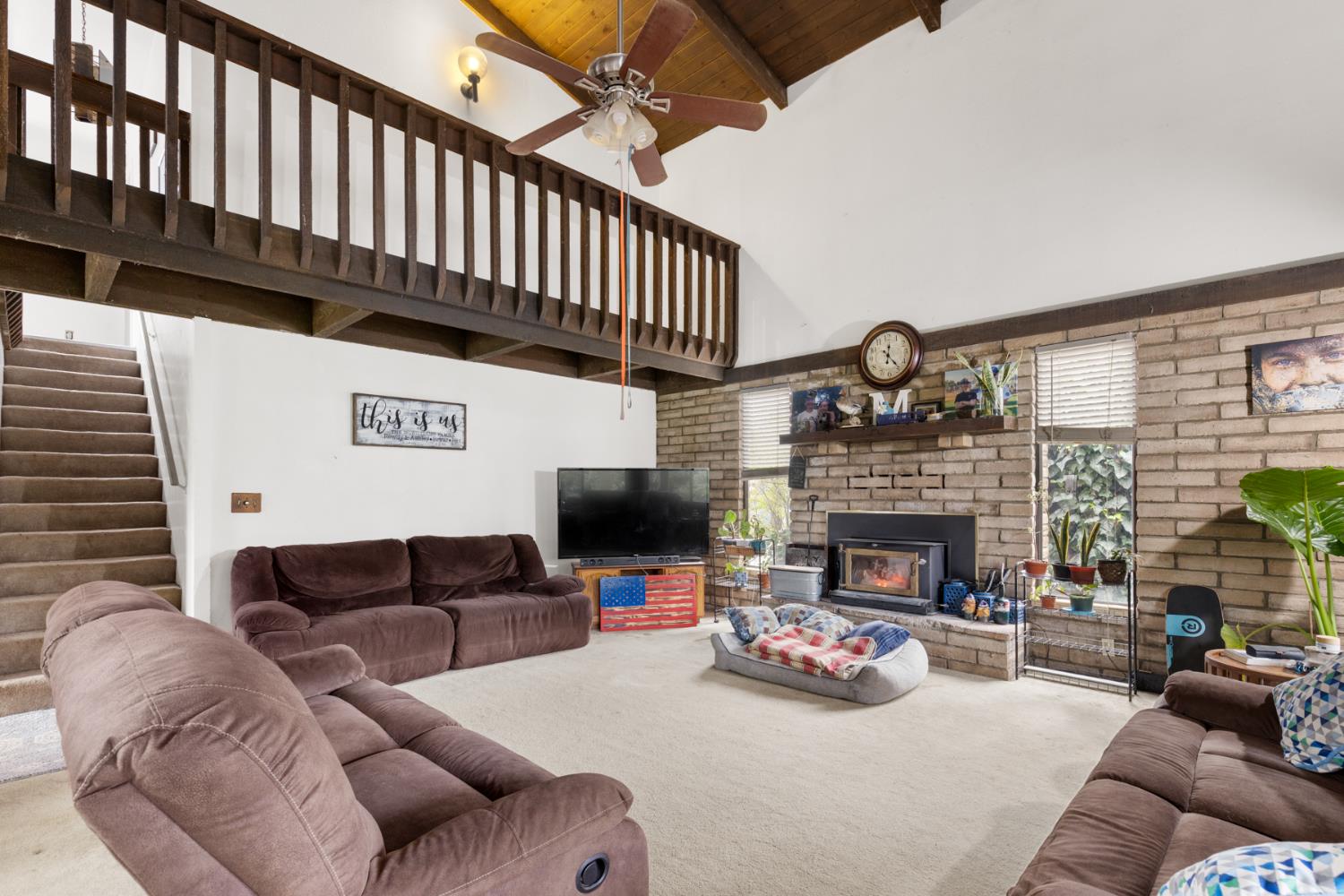 3781 Larkin Road Biggs, CA 95917 - Photo 6 of 34 a living room with furniture a fireplace and a flat screen tv