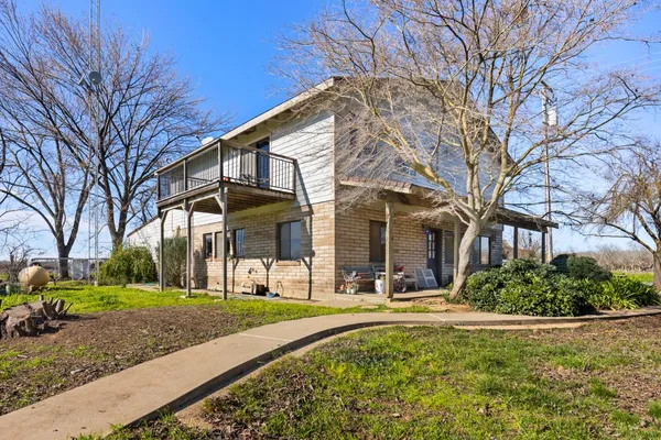 a view of a building with a yard