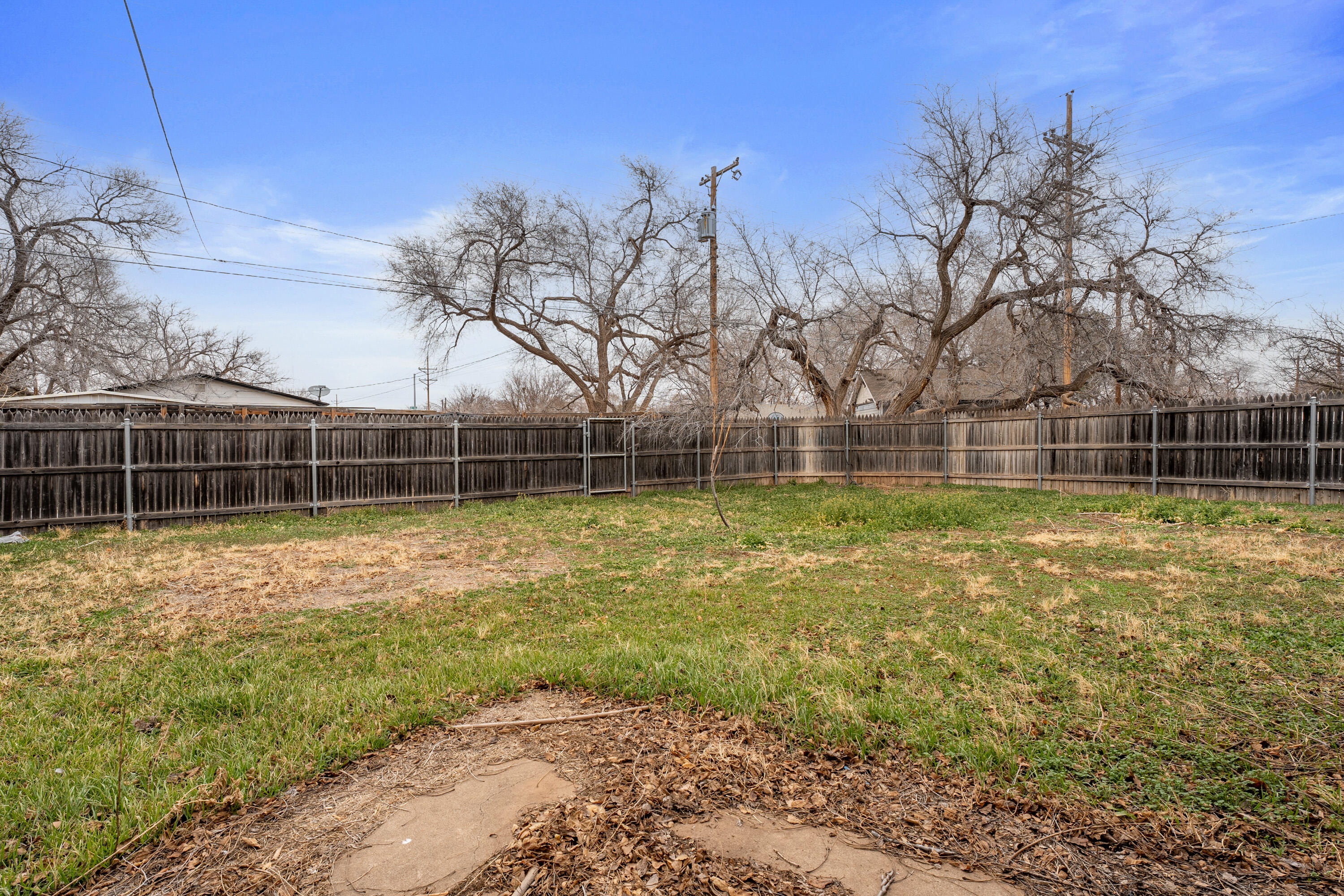 3602 31st Street Lubbock, TX 79410 - Photo 13 of 15 a view of a yard with a house and trees
