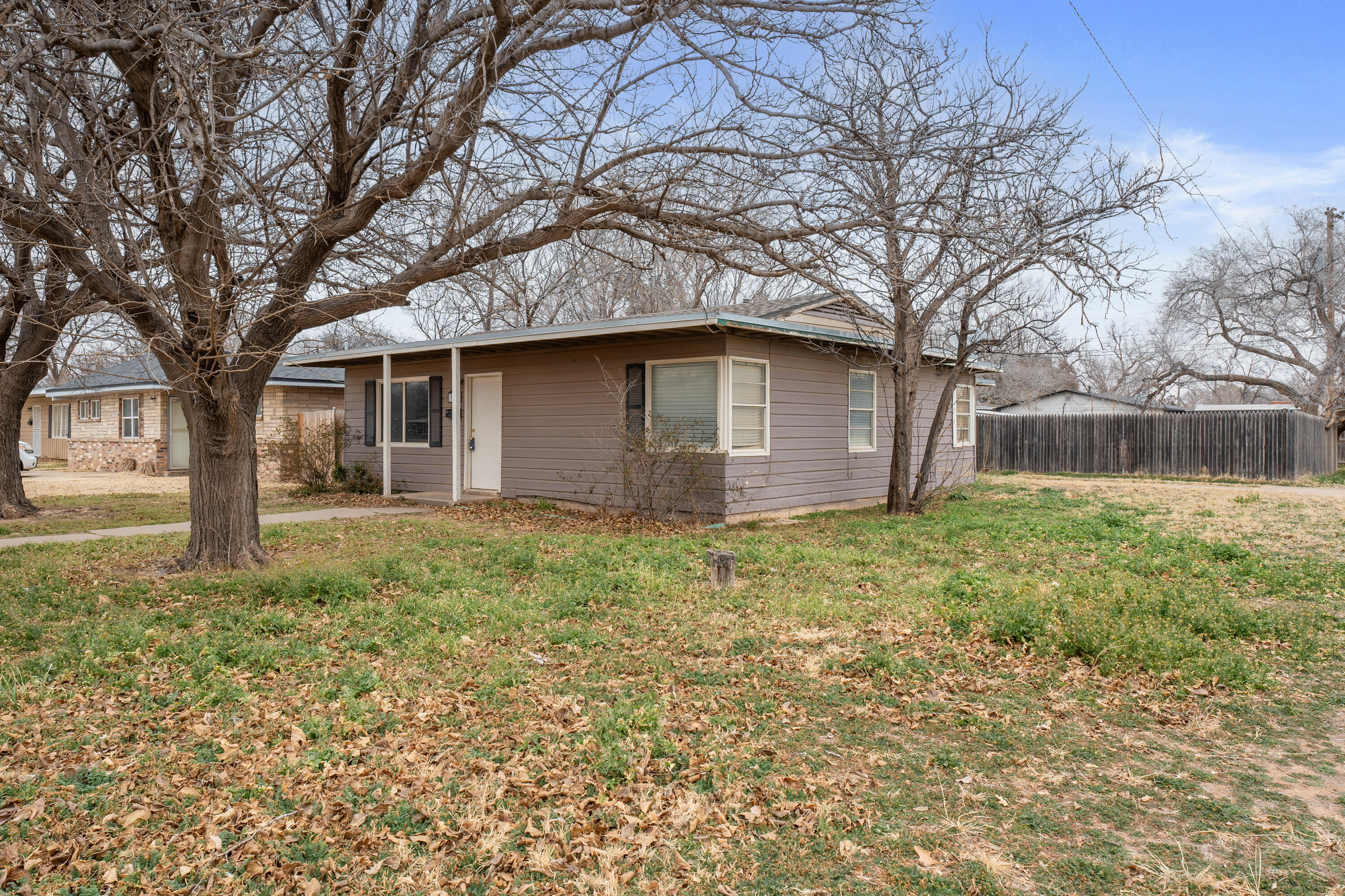 3602 31st Street Lubbock, TX 79410 - Photo 15 of 15 a front view of a house with garden