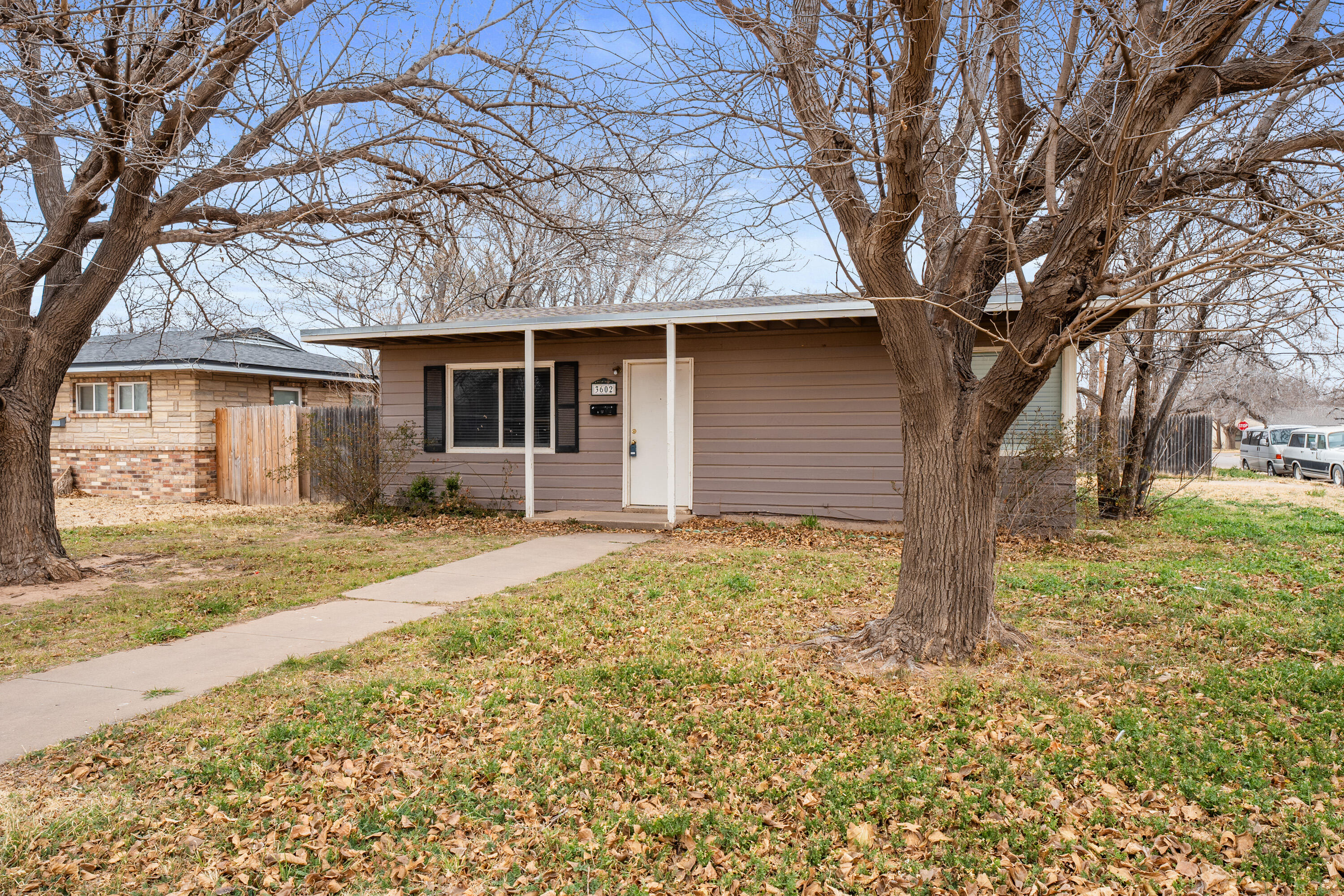 3602 31st Street Lubbock, TX 79410 - Photo 2 of 15 front view of house with a yard