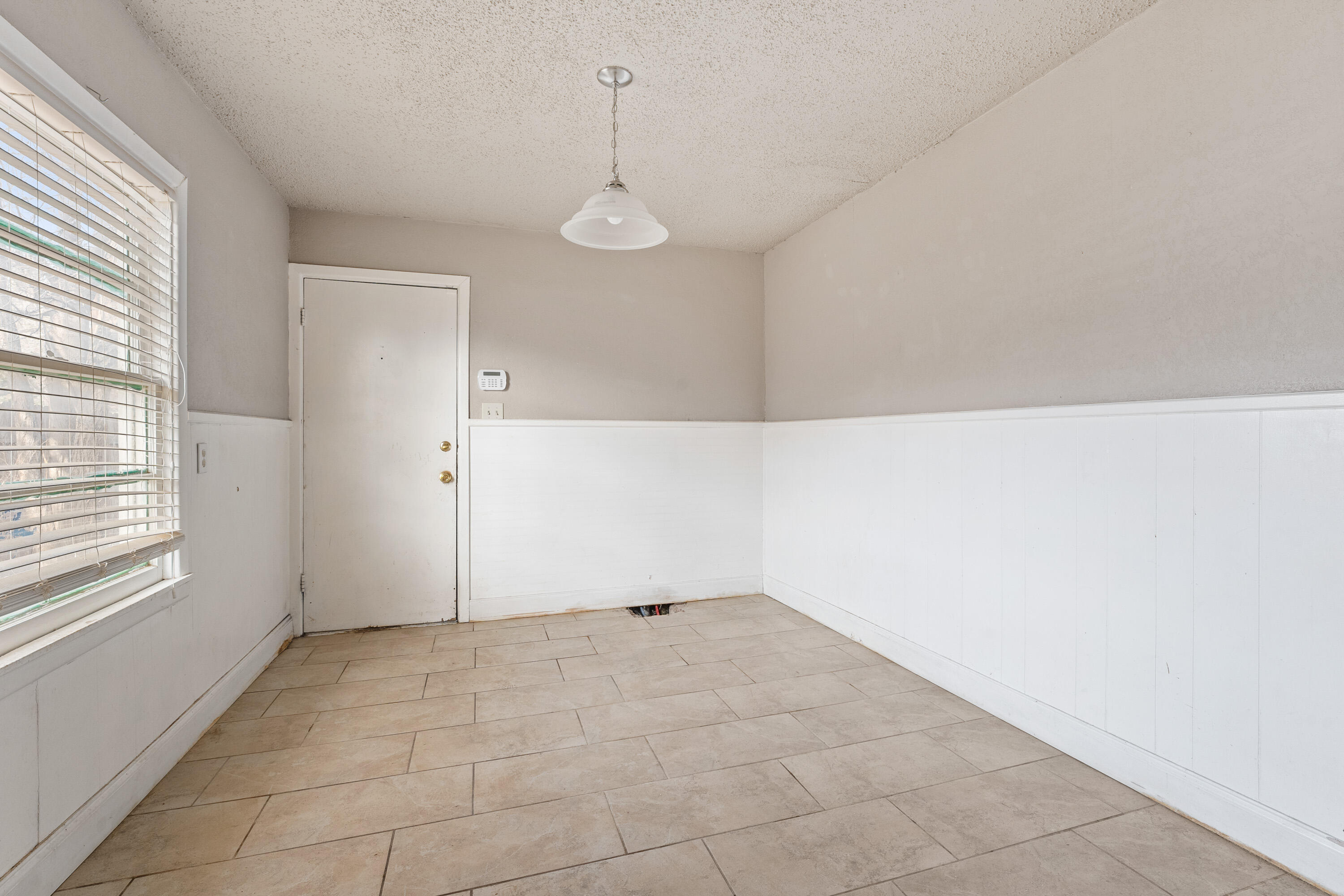 3602 31st Street Lubbock, TX 79410 - Photo 9 of 15 a view of an empty room with a window