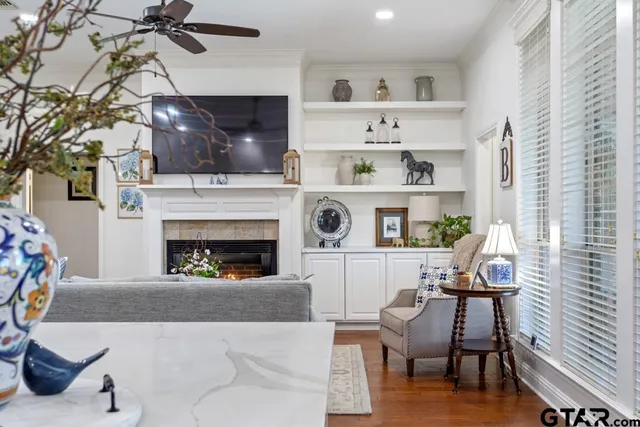 a living room with furniture and a fireplace