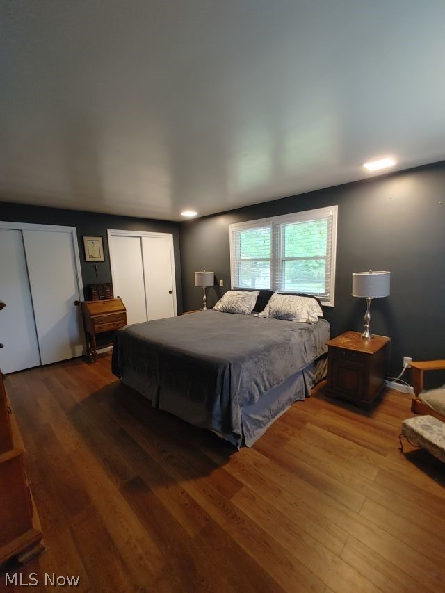 2211 Devonshire Road Northwest Canton, OH 44708 - Photo 21 of 36 Bedroom with two closets and wood-type flooring