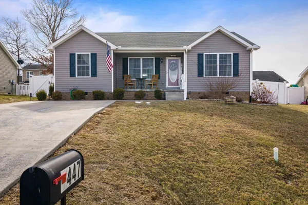 a view of a house with a yard