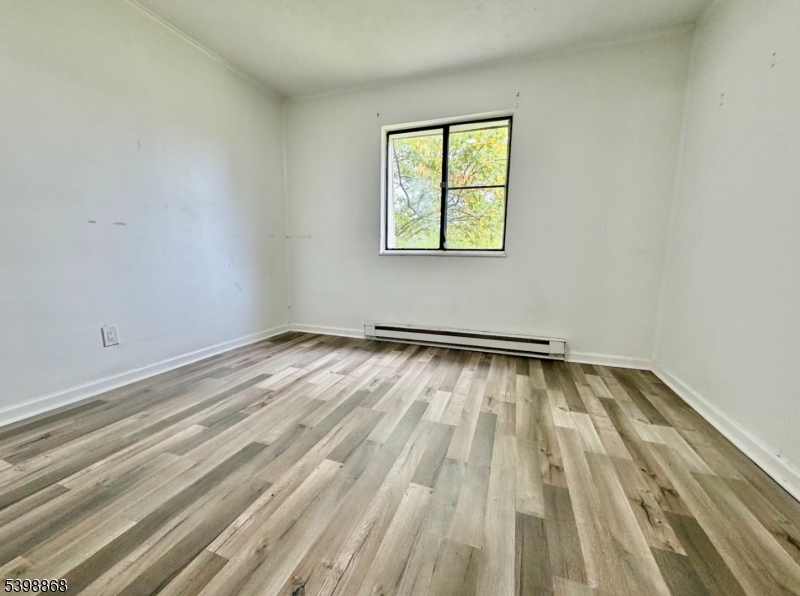 207 Old Chimney Ridge Road, Unit K Montague, NJ 07827 - Photo 4 of 10 an empty room with a window
