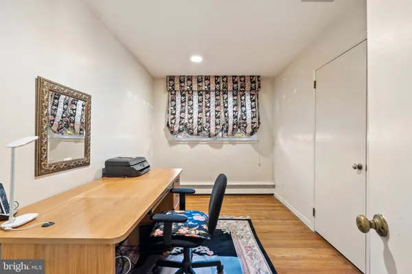 a view of a room with furniture and wooden floor
