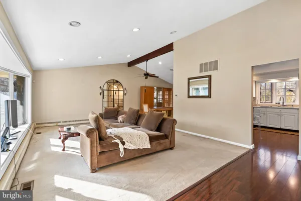 a bedroom with bed and wooden floor