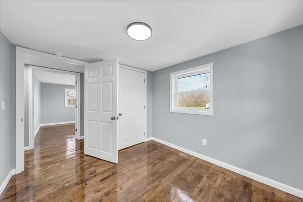 a view of an empty room and window
