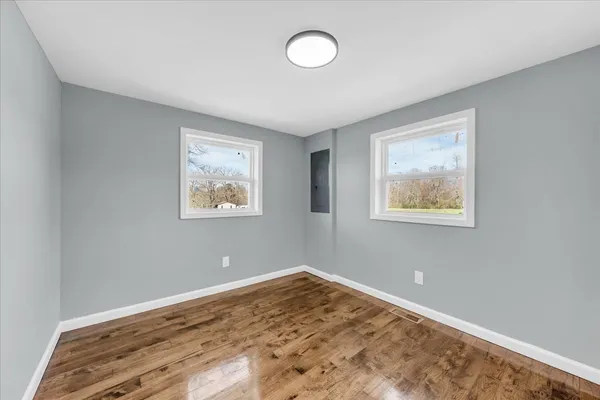 a view of room with window and ceiling fan