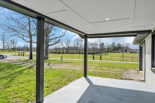 a view of a room with yard from a window