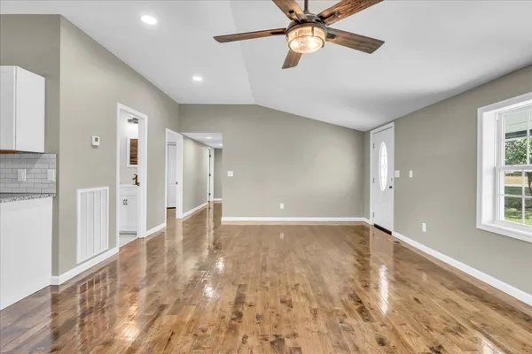 a view of an empty room with a window