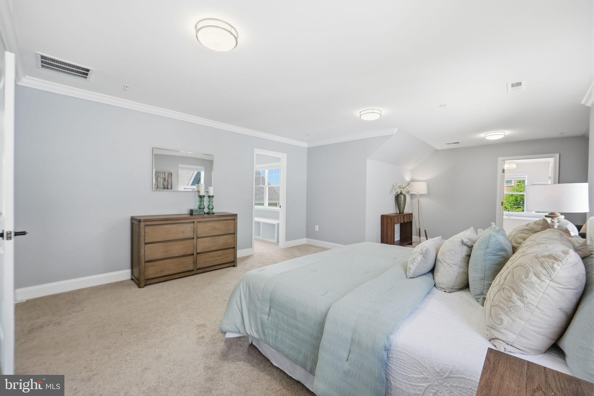 14309 Drayton Avenue Silver Spring, MD 20904 - Photo 16 of 44 a bedroom with a bed and ceiling fan
