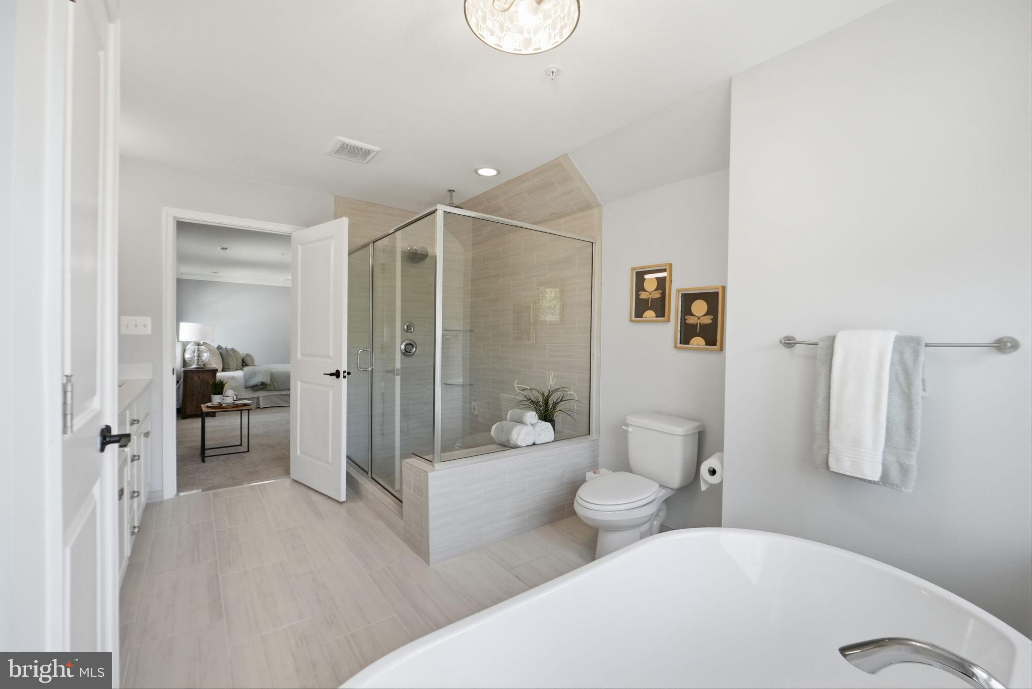 14309 Drayton Avenue Silver Spring, MD 20904 - Photo 21 of 44 a bathroom with a double vanity sink toilet and shower