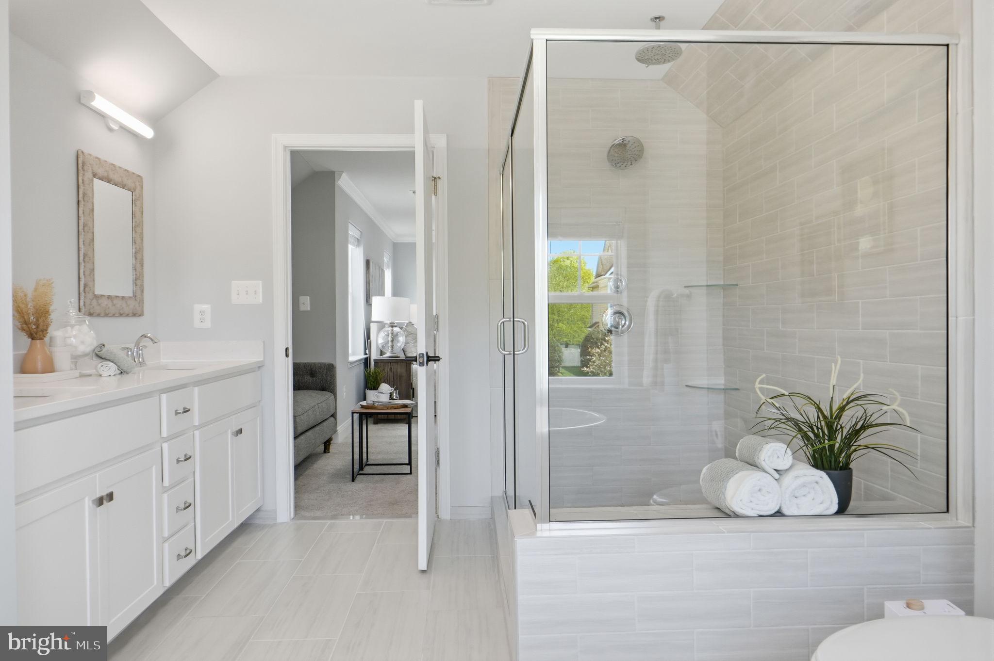 14309 Drayton Avenue Silver Spring, MD 20904 - Photo 22 of 44 a bathroom with a shower sink and mirror