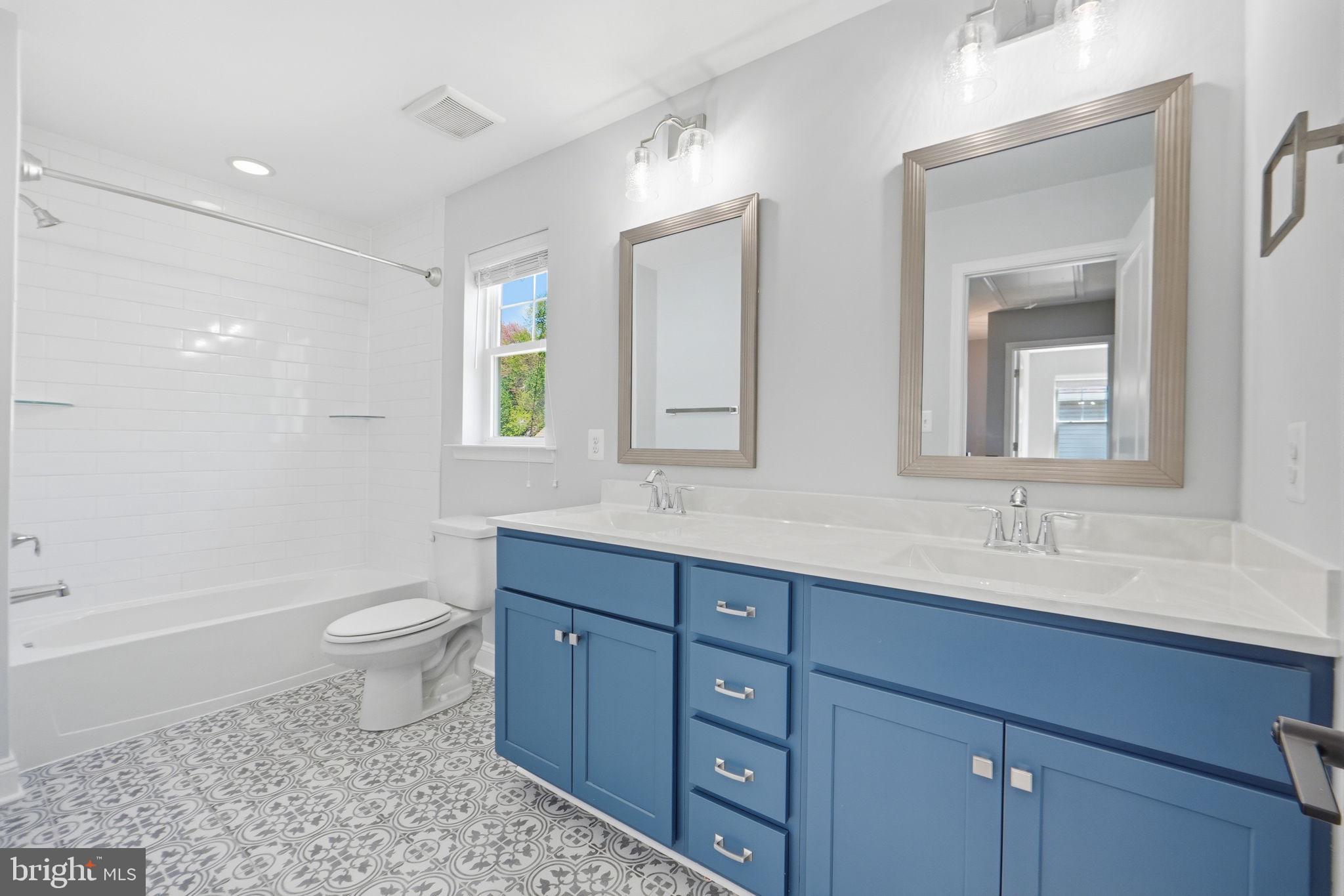 14309 Drayton Avenue Silver Spring, MD 20904 - Photo 25 of 44 a bathroom with double sink toilet and shower